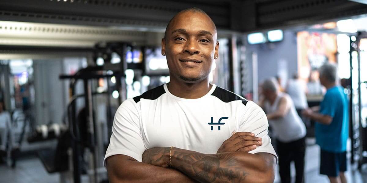 man smiling in a gym